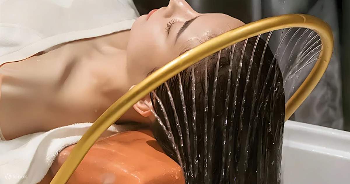 Woman receiving a relaxing head spa treatment